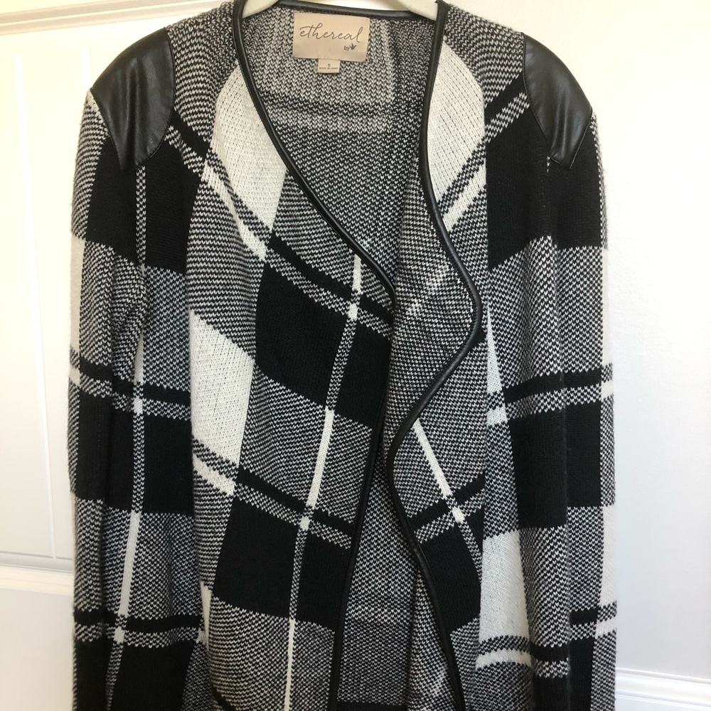 black and white sweater with leather